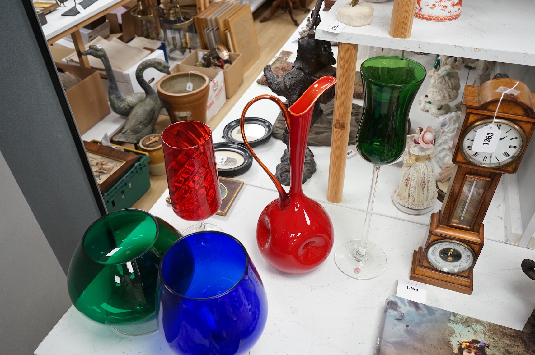 Five pieces of mid-century coloured glassware, to include a jug and an oversized brandy balloon, largest 48cm high